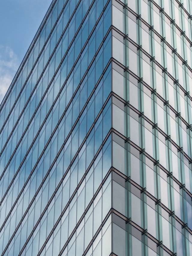 Glass facade of a modern commercial building